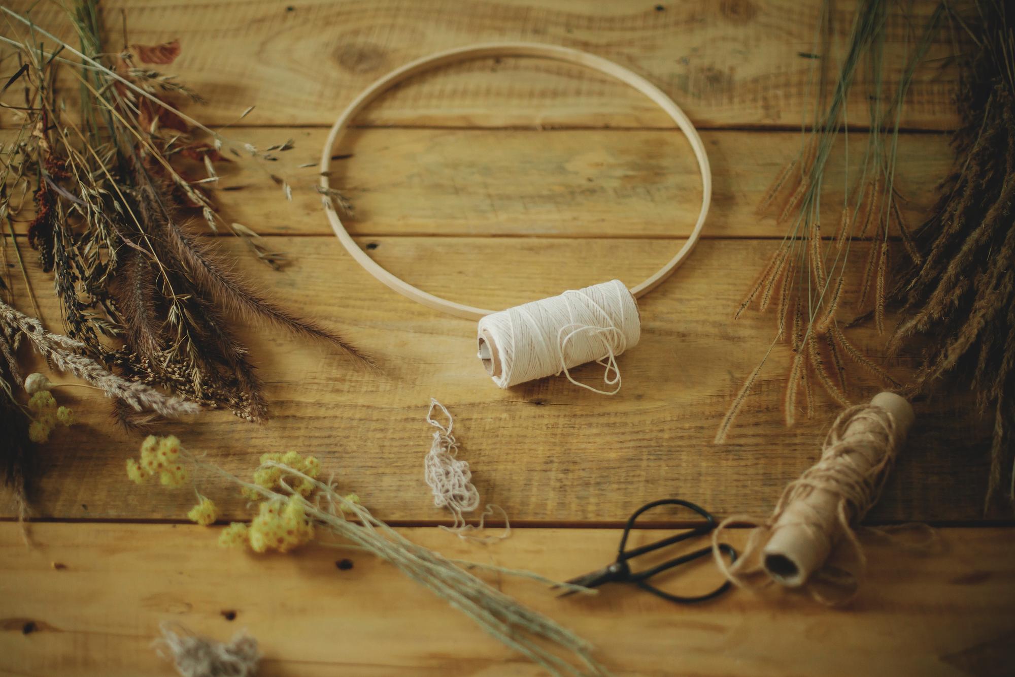 studio with threads and hoops on a wooden table